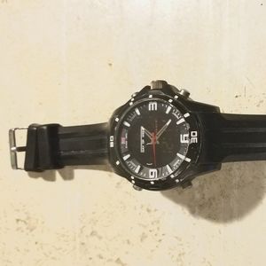 Black wrist watch US Polo Assn. Stainless steel back, rubber wristband.